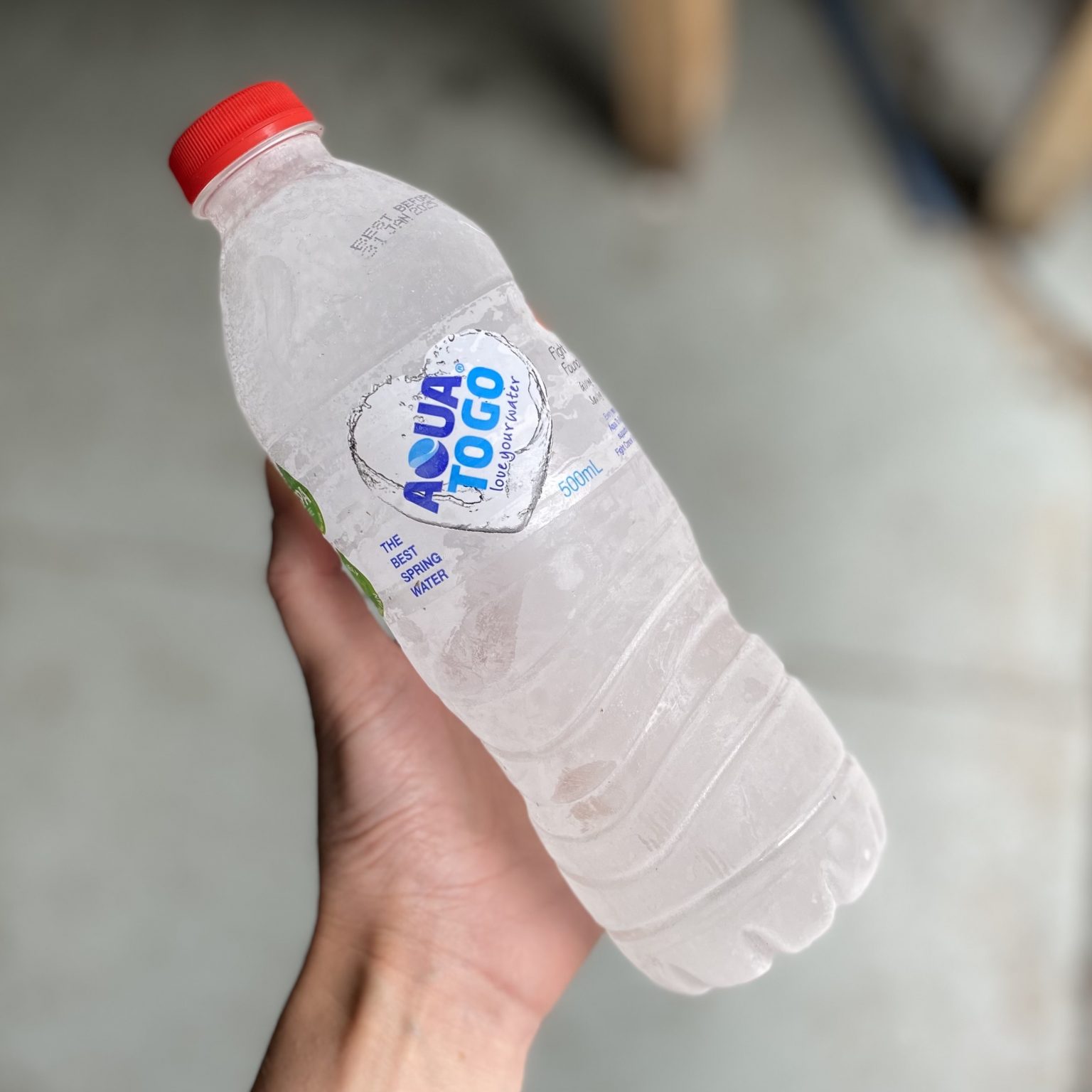 Reusable frozen water bottles used to chill our returnable insulated packaging