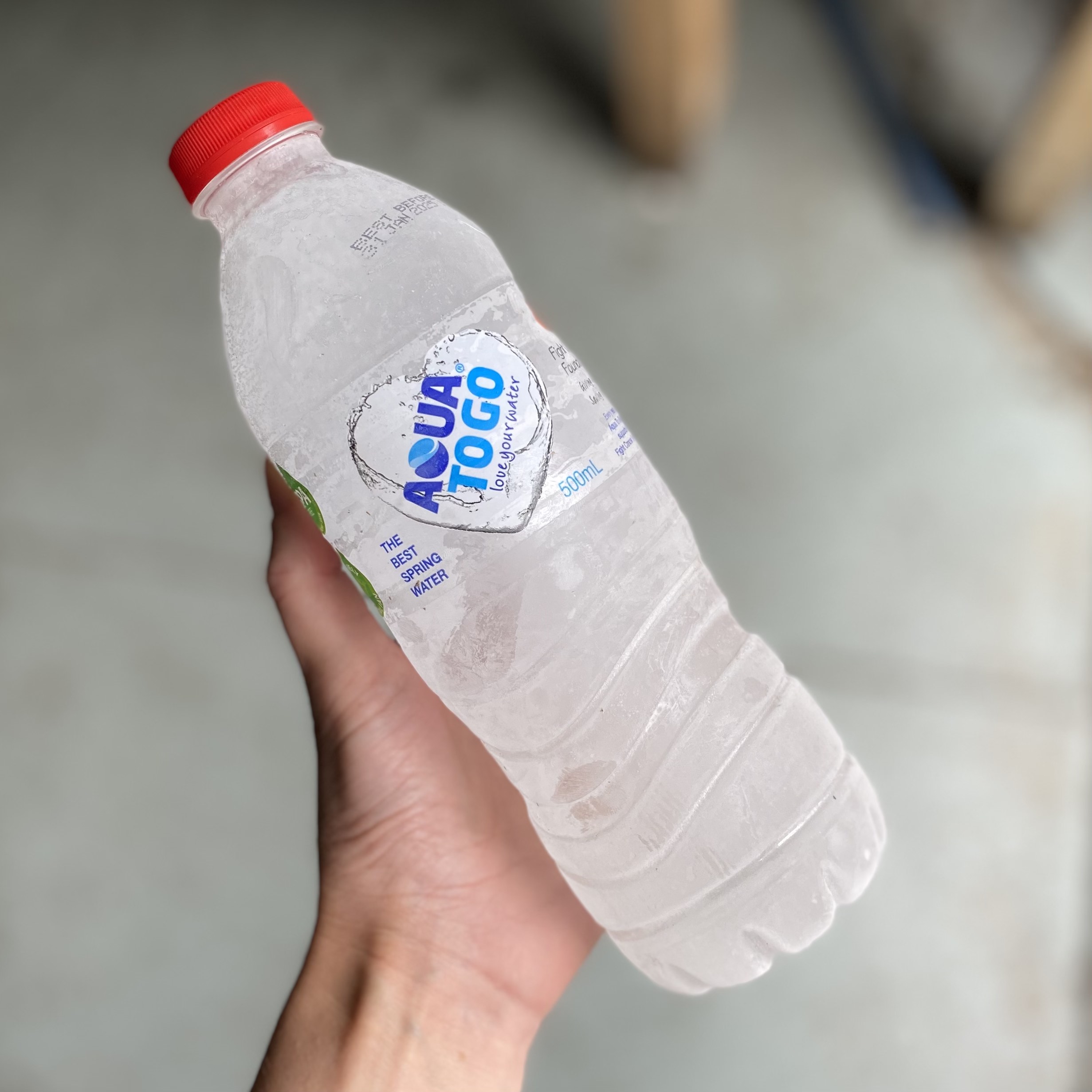 Reusable frozen water bottles used to chill our returnable insulated packaging