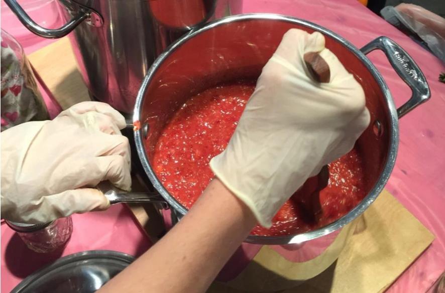 Fermenting workshop, stirring a pot.