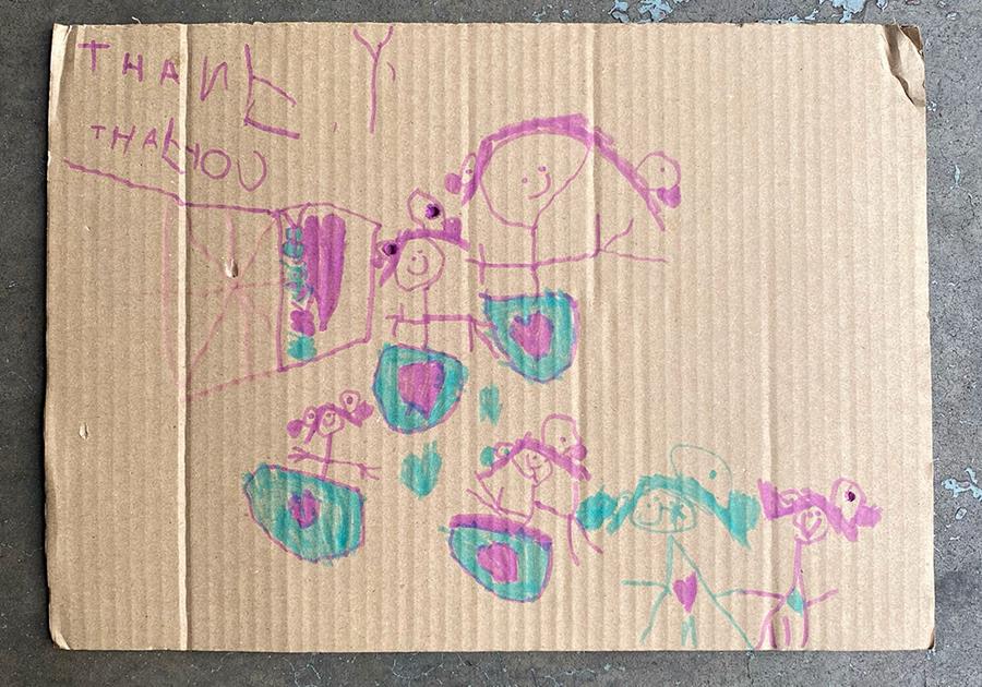 Cardboard Box insert with a toddler's drawing and words 'thank you' - CERES Fair Food