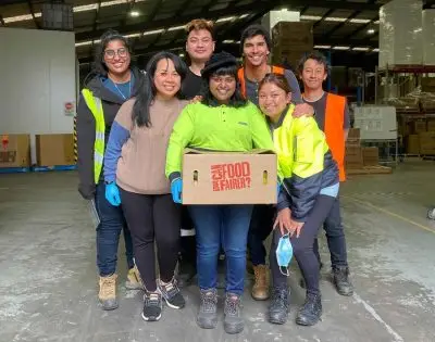 Fair Food staff pose with new box design